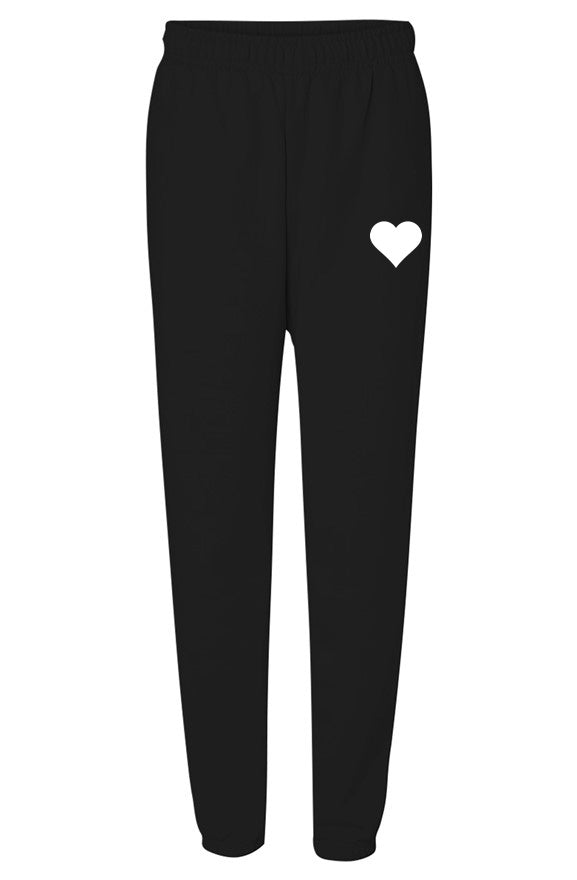 Black elastic waist sweatpants with white heart logo on flat white background