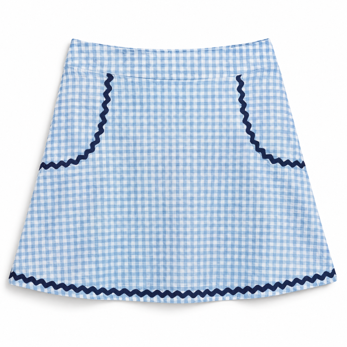 A light blue and white gingham skirt with dark navy blue zigzag trim along the waistband, pocket edges, and bottom hem, shown flat against a white background.