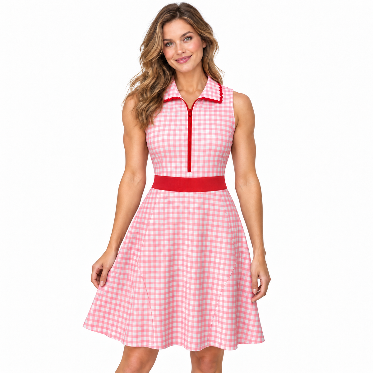 A woman modeling a sleeveless pink and white gingham dress with a red collar trim, red front zipper, and a red waistband, set against a plain white background.