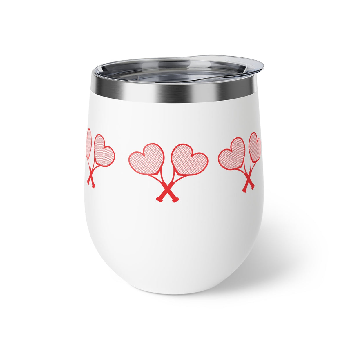 White tumbler with red heart designs on a white background