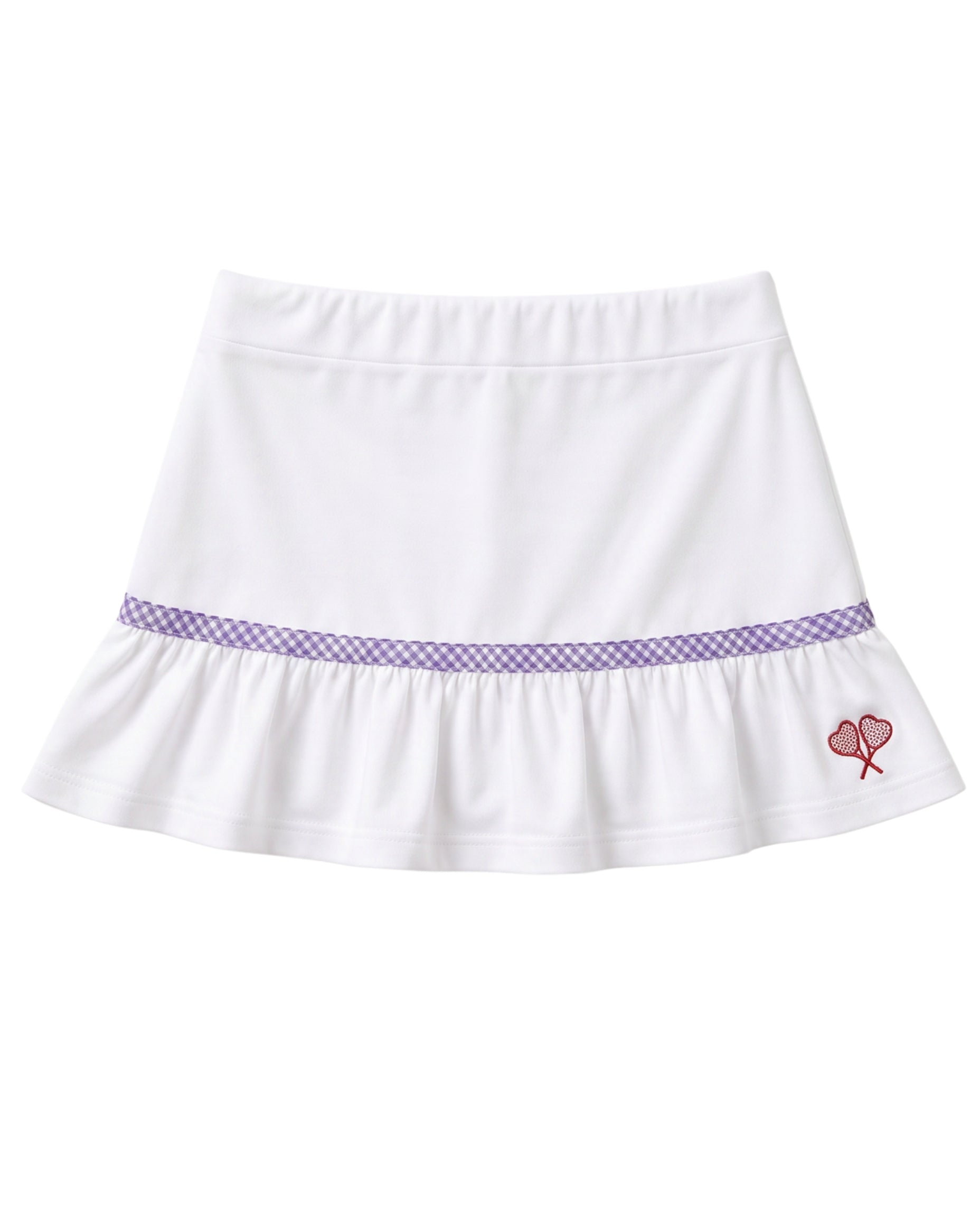 A white ruffled skirt with a purple gingham pattern band around the waist and a small red embroidered heart tennis rackets crossed motif on the lower right side, shown against a plain white background.