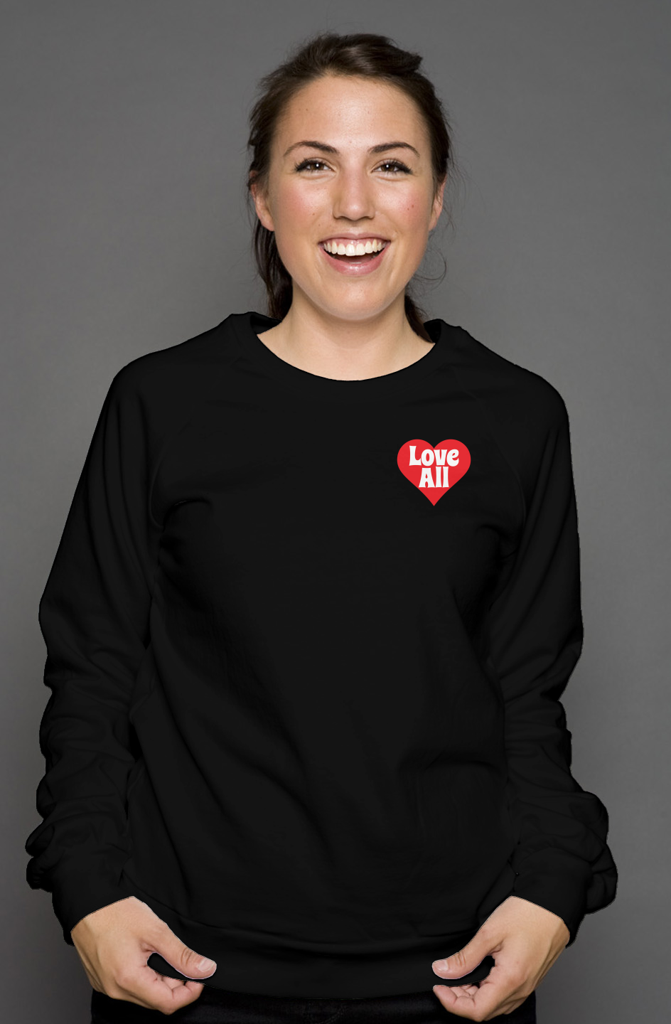 Person wearing a black sweatshirt with a red heart design on a gray background