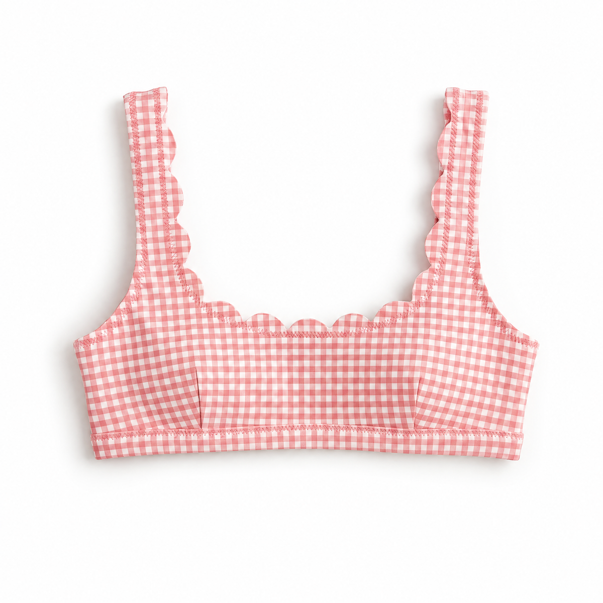 A pink and white gingham check bikini top with scalloped straps, laid flat on a white background.