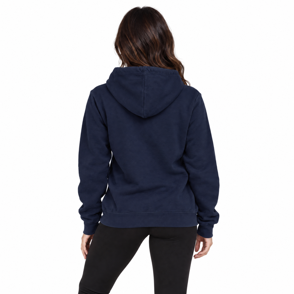 A woman viewed from the back wearing a navy blue pullover hoodie and black leggings against a plain white background.