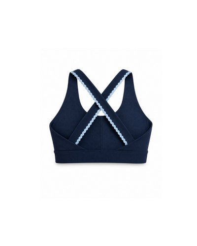 Navy blue sports bra with white lace trim on a white background