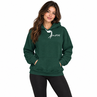 A woman modeling a dark green pullover hoodie with a white graphic print on the left chest that reads 'Love is Gift of God' with a wave design, paired with black leggings against a plain white background.