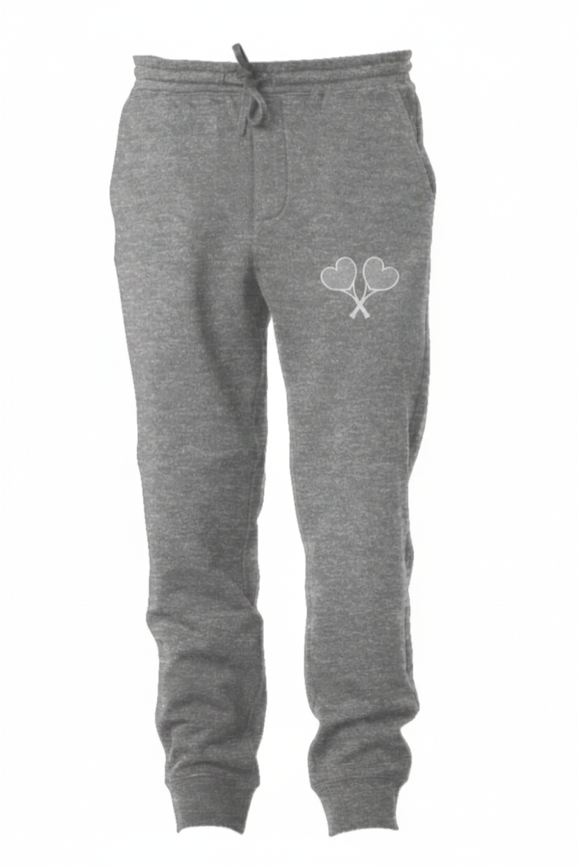 Gray sweatpants with a heart and tennis racket design on a white background