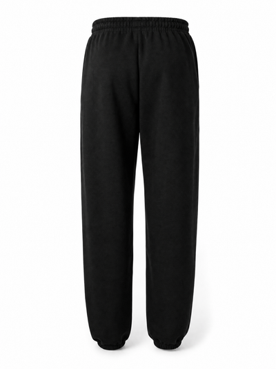 Black sweatpants with an elastic waistband and tapered legs, shown from the back on a white background.