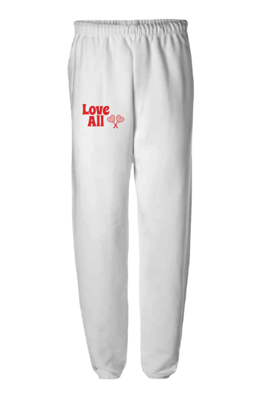 White sweatpants with 'Love All' text and heart design on a white background