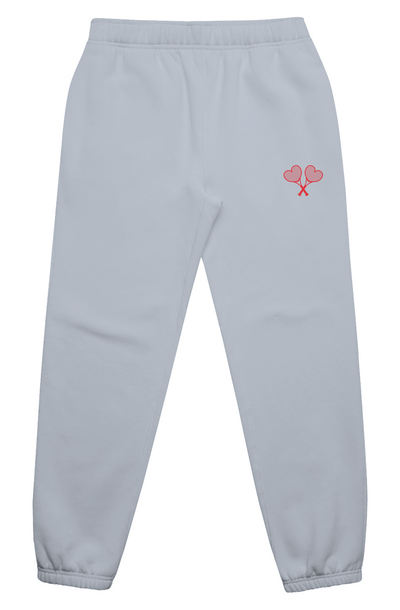 Light gray sweatpants with a red heart and tennis racket design on a white background