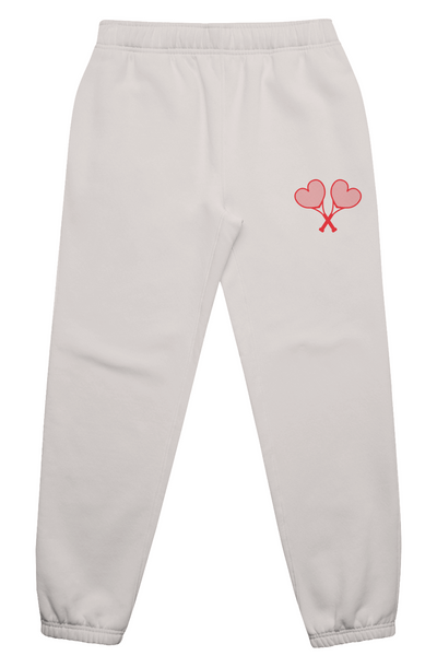 Light gray sweatpants with a red heart design on a white background
