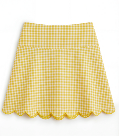 Yellow and white gingham skirt with yellow scalloped hem on flat white background