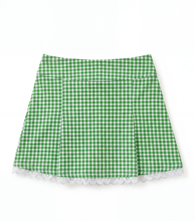 Green and white gingham skirt with white lace trim on a flat white background