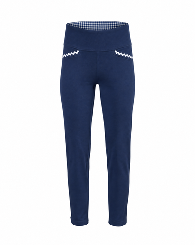 A pair of navy blue cropped pants with a wide waistband, featuring a blue and white gingham pattern lining inside the waistband and white zigzag embroidered details on the front of each leg.