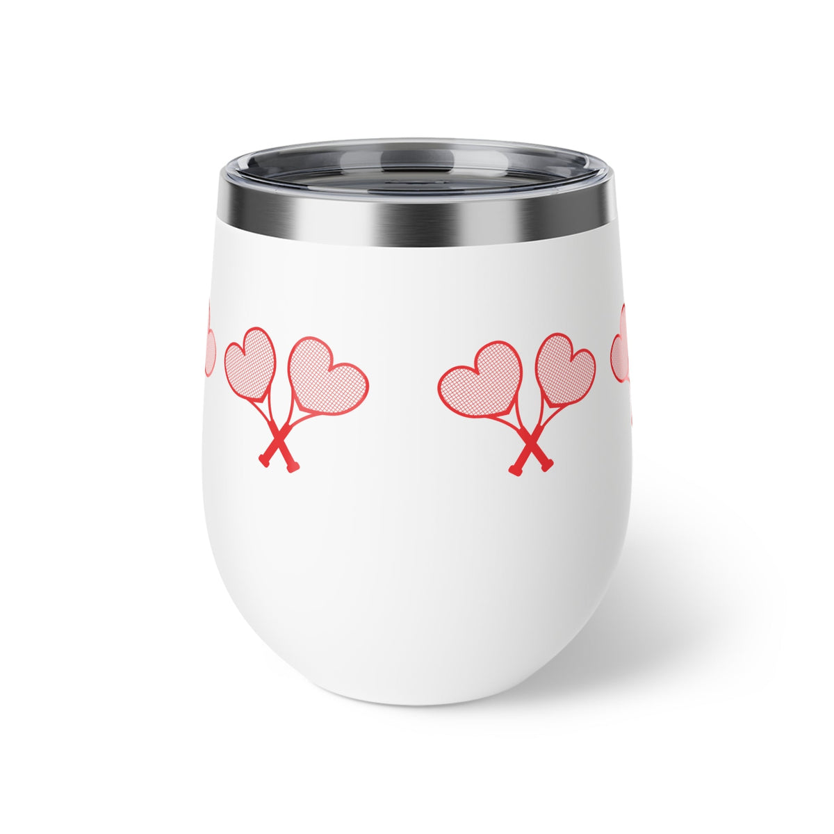 White tumbler with red heart designs on a white background