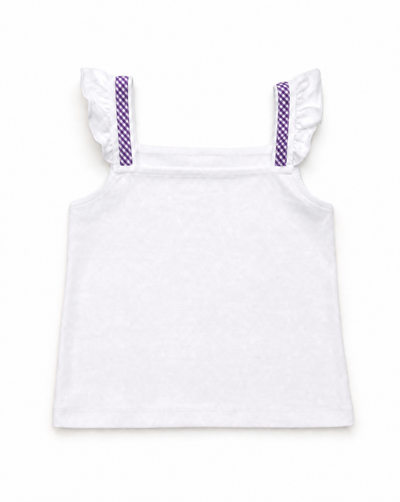 A white sleeveless children's top with ruffled shoulder straps and purple patterned strap details, shown flat against a white background.