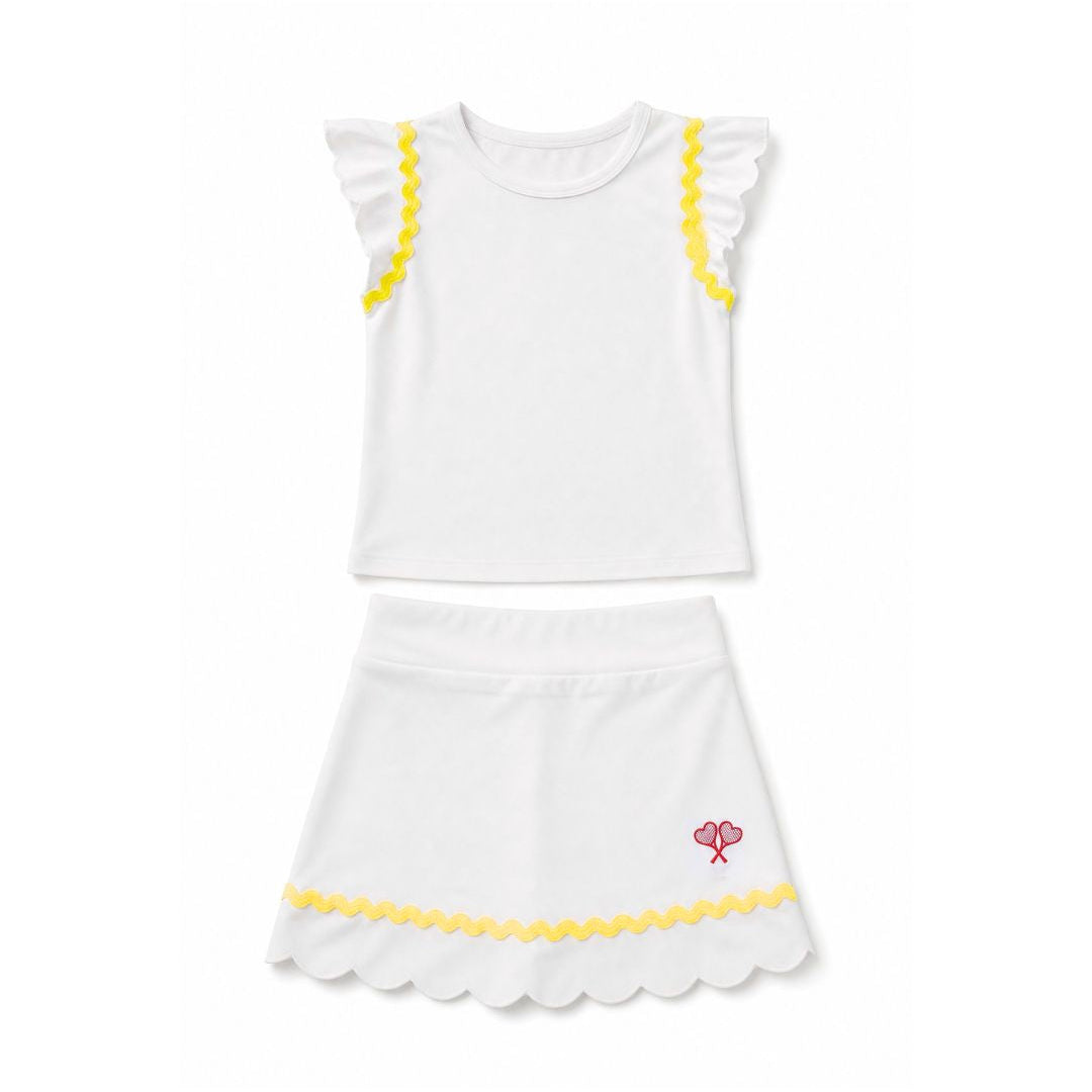 White top and skirt set with yellow trim on a white background