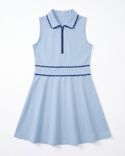 Light blue dress with dark blue trim on a white background
