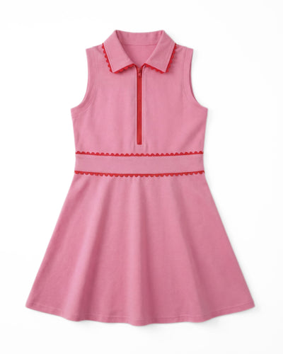Pink dress with red trim on a white background