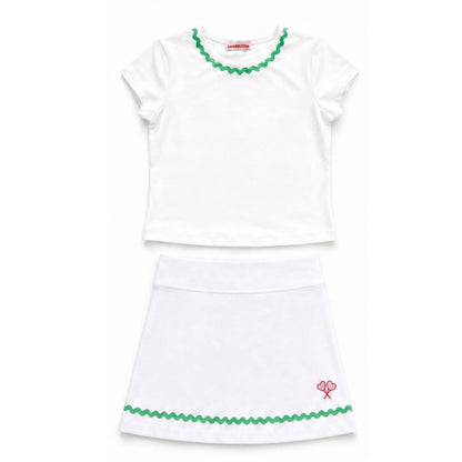 White top and skirt set with green trim on a white background