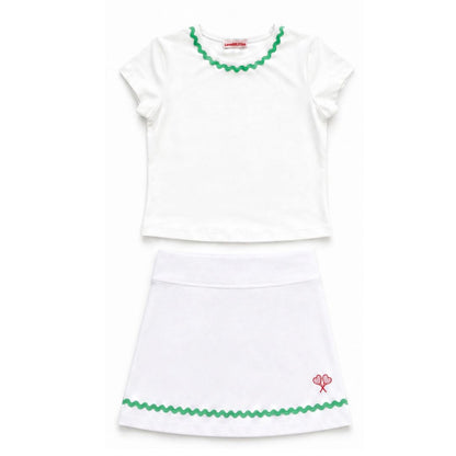 White top and skirt set with green trim on a white background