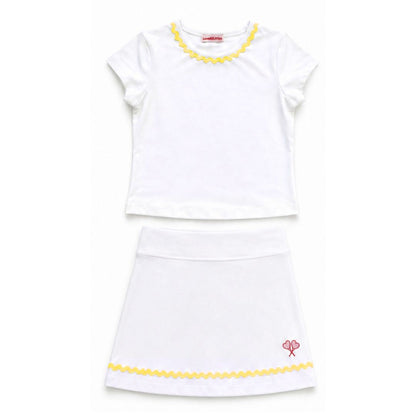 White top and skirt with yellow trim on a white background