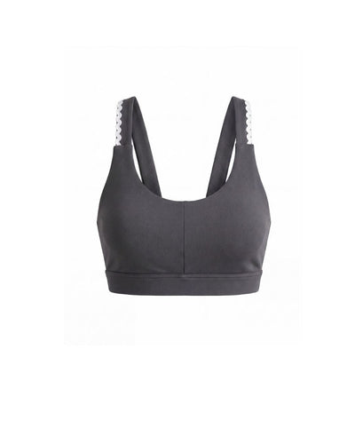Gray sports bra with white trim on a white background