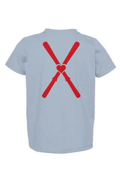 Light blue t-shirt with red heart and crossbones design on a white background