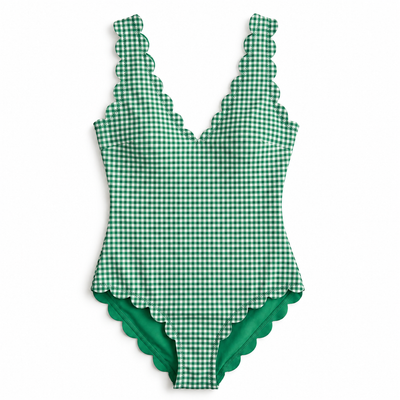 A green and white gingham one-piece swimsuit with scalloped edges, shown flat against a white background.