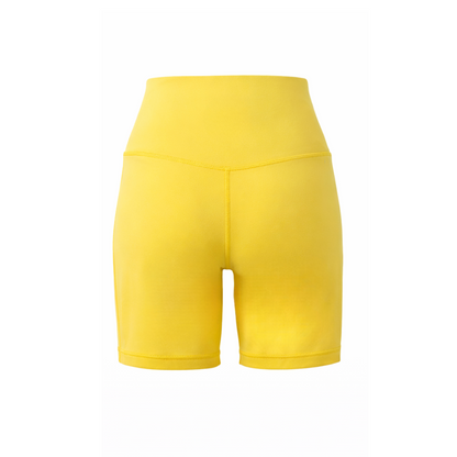 Yellow athletic shorts on a white background