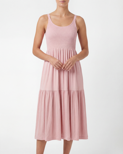 Pink dress worn by a person on a white background