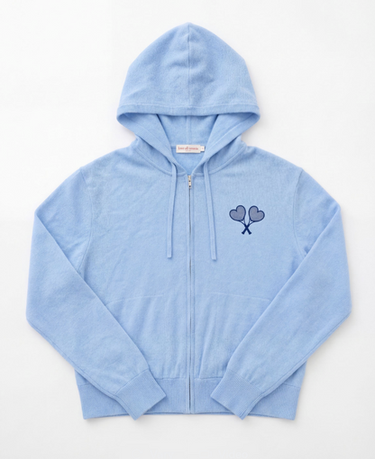 Light blue hoodie with a logo on the chest against a white background