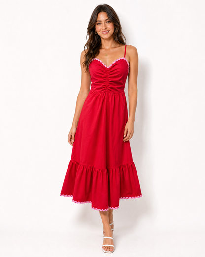 Woman in red and pink dress on white background
