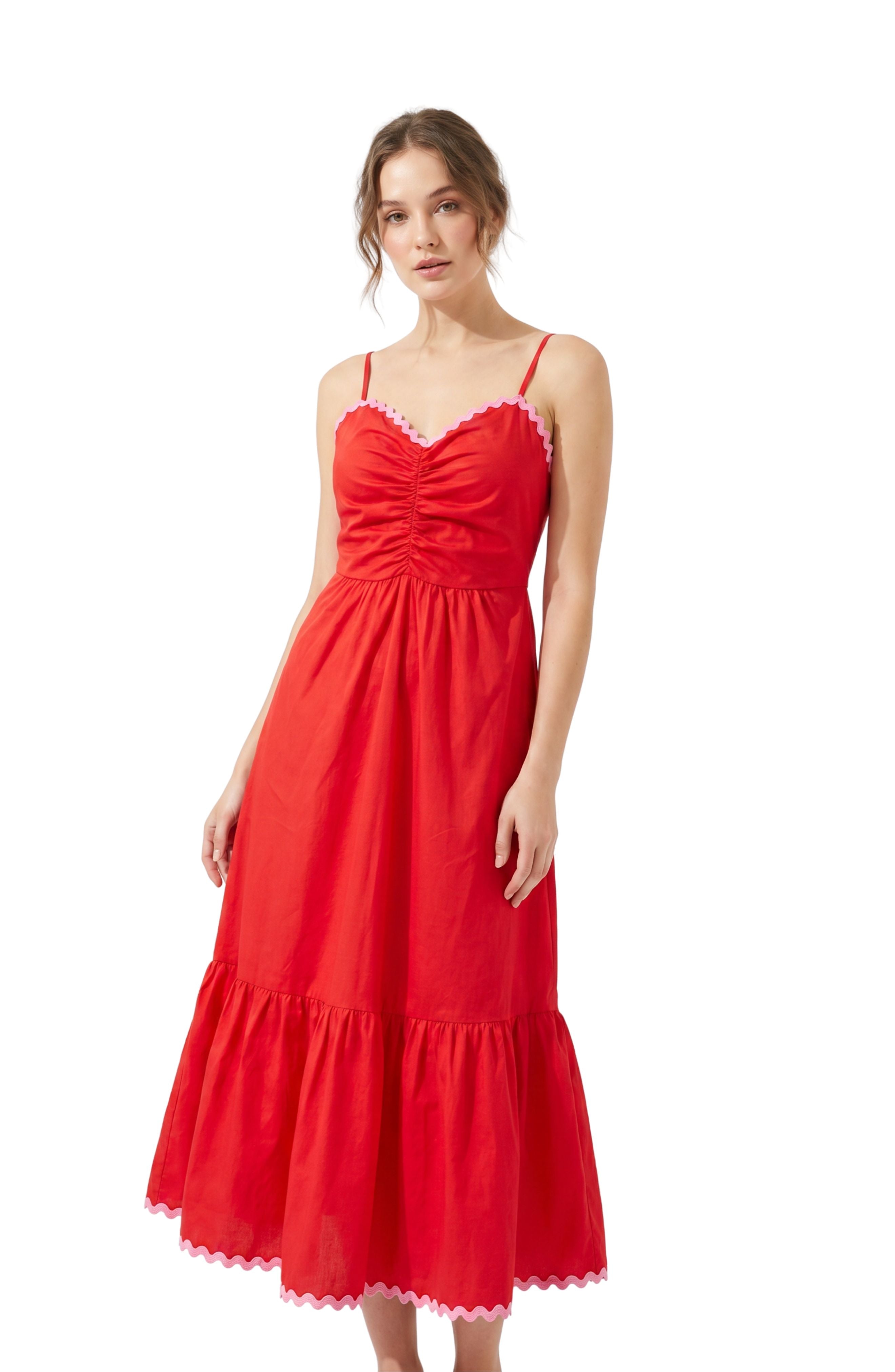 Woman in red and pink dress on white background