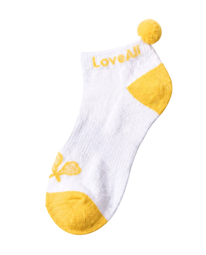 White sock with yellow accents and 'Love All' branding on a white background
