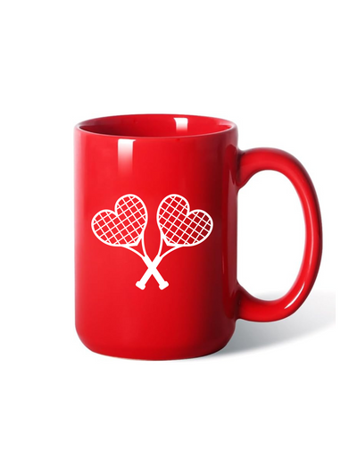 Red mug with white tennis racket design on a white background