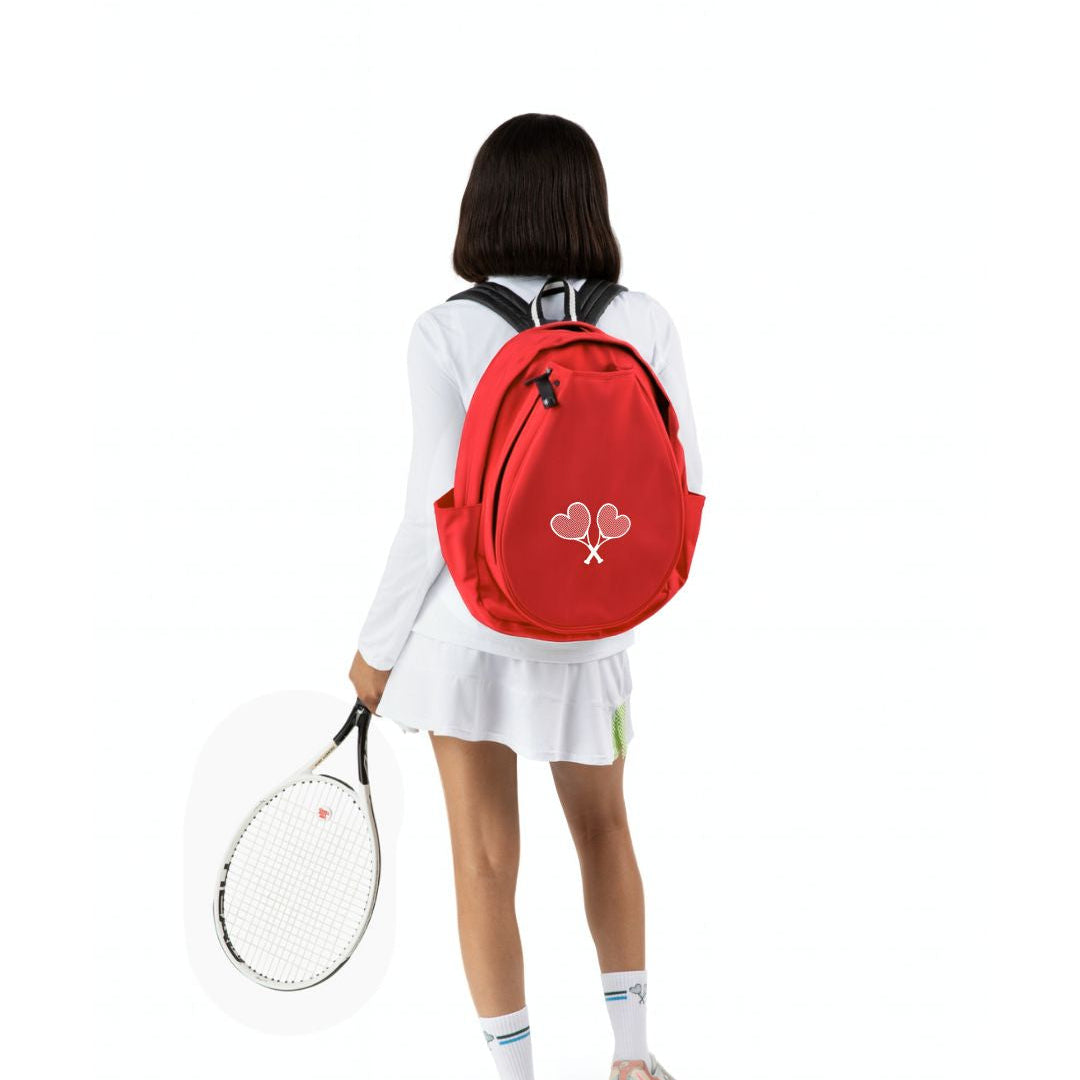 Person wearing a red backpack with a tennis racket on a white background