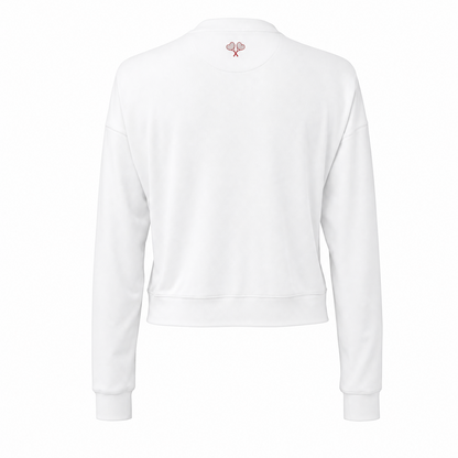 White top with a small logo on the chest against a white background
