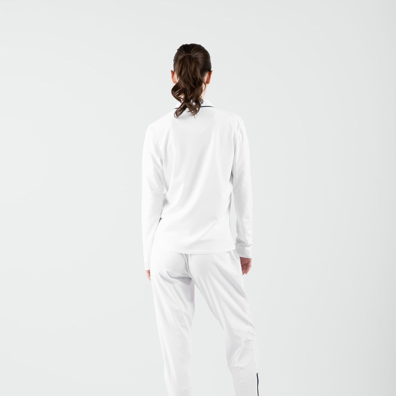 Person wearing a white outfit on a white background