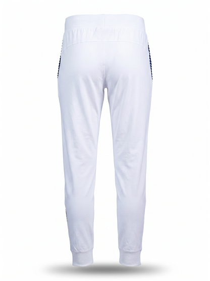 White athletic jogger pants shown from the back, featuring a wide elastic waistband and side stripes with a black-and-white checkered pattern, set against a plain white background.