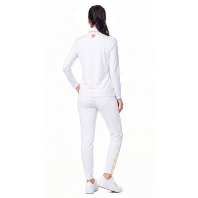 A woman shown from the back wearing a white athletic tracksuit with a long-sleeve top and matching jogger pants, featuring small yellow and red accents on the collar and leg.