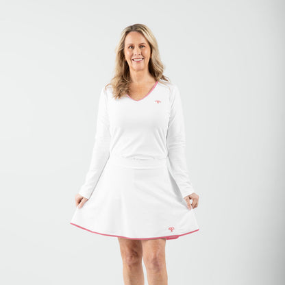 Woman wearing a white dress with a red trim on a white background