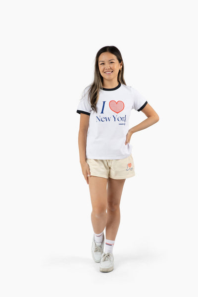 Person wearing a 'I ❤️ New York' t-shirt on a white background