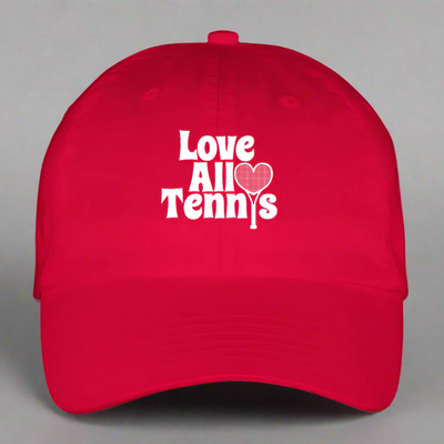 Red cap with 'Love All Tennis' text and heart design on a gray background