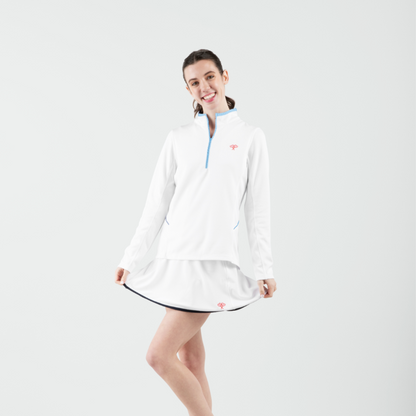 Woman wearing a white dress with a blue collar on a white background