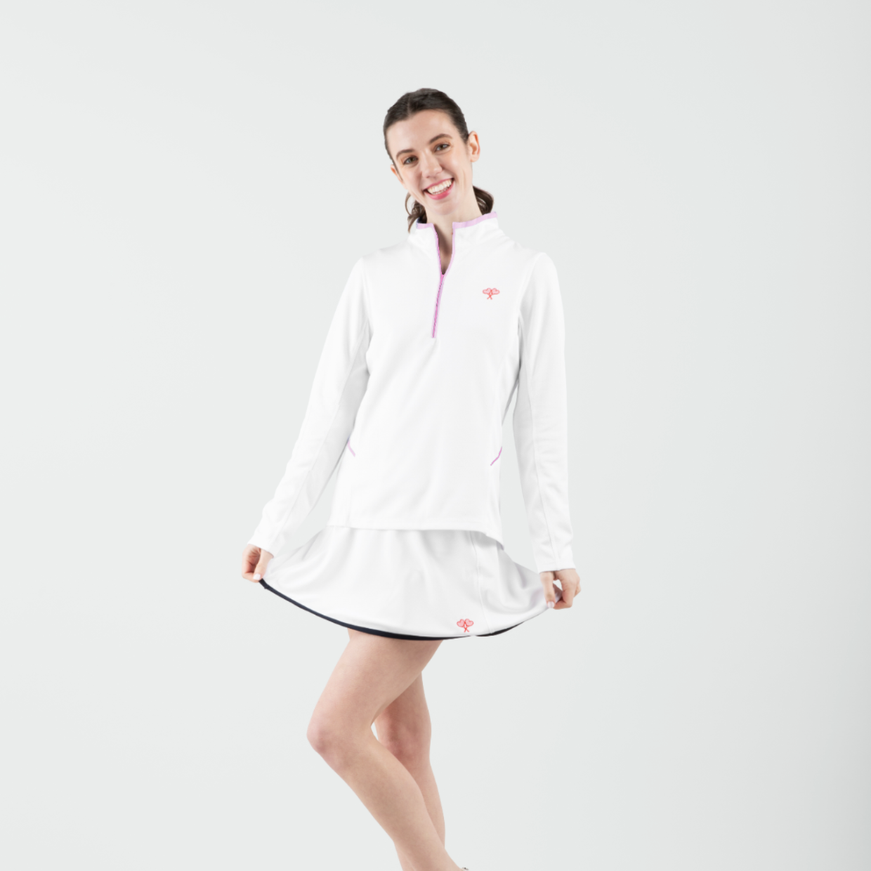 Woman wearing a white dress with a logo on a white background