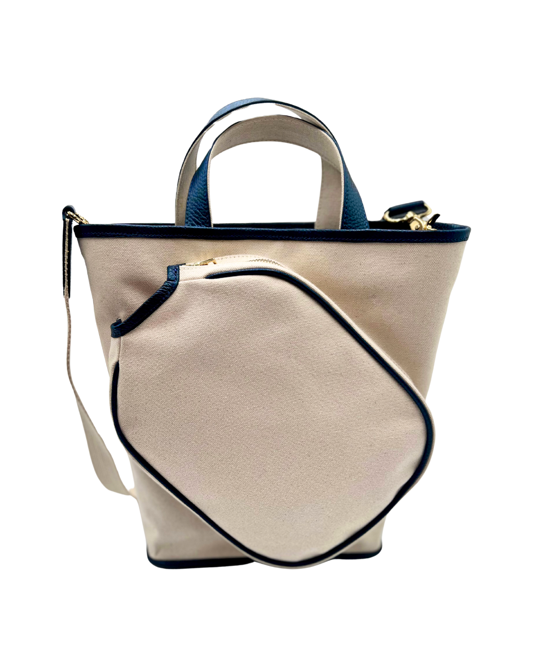 A cream-colored canvas tote bag with navy blue trim, dual top handles, and a matching zippered front pouch, shown against a plain white background.