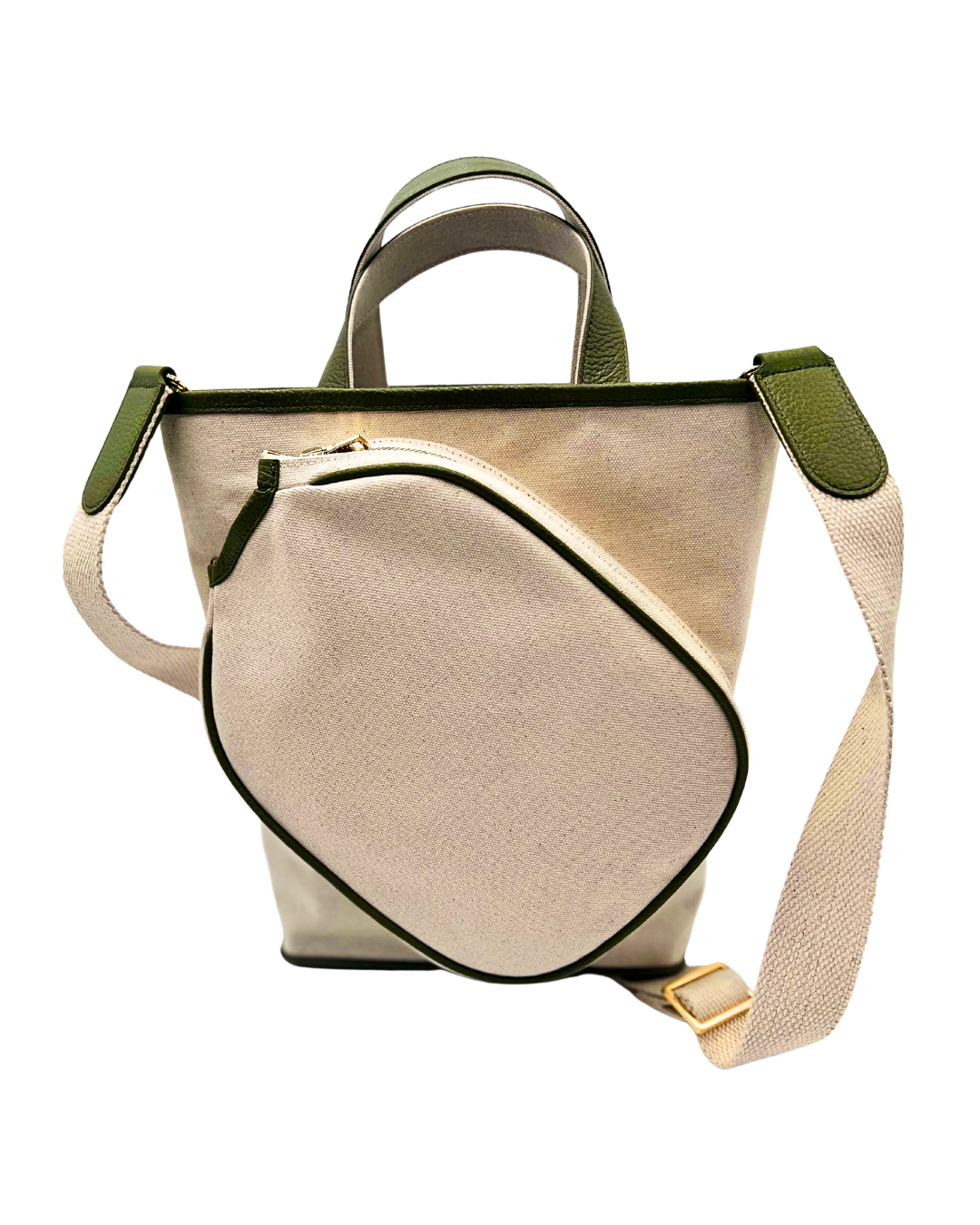 A beige canvas bucket bag with olive green leather trim, dual top handles, and a matching beige webbing shoulder strap with a gold-tone buckle, shown on a plain white background.