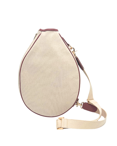 A teardrop-shaped canvas shoulder bag in beige with burgundy trim and a matching beige adjustable shoulder strap, shown on a plain white background.