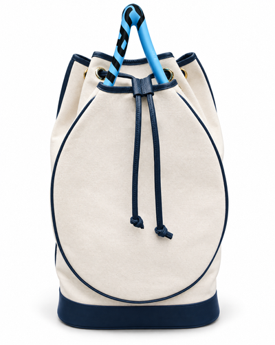 An off-white canvas bucket bag with navy blue trim, drawstring closure, and a bright blue handle, shown against a plain white background.